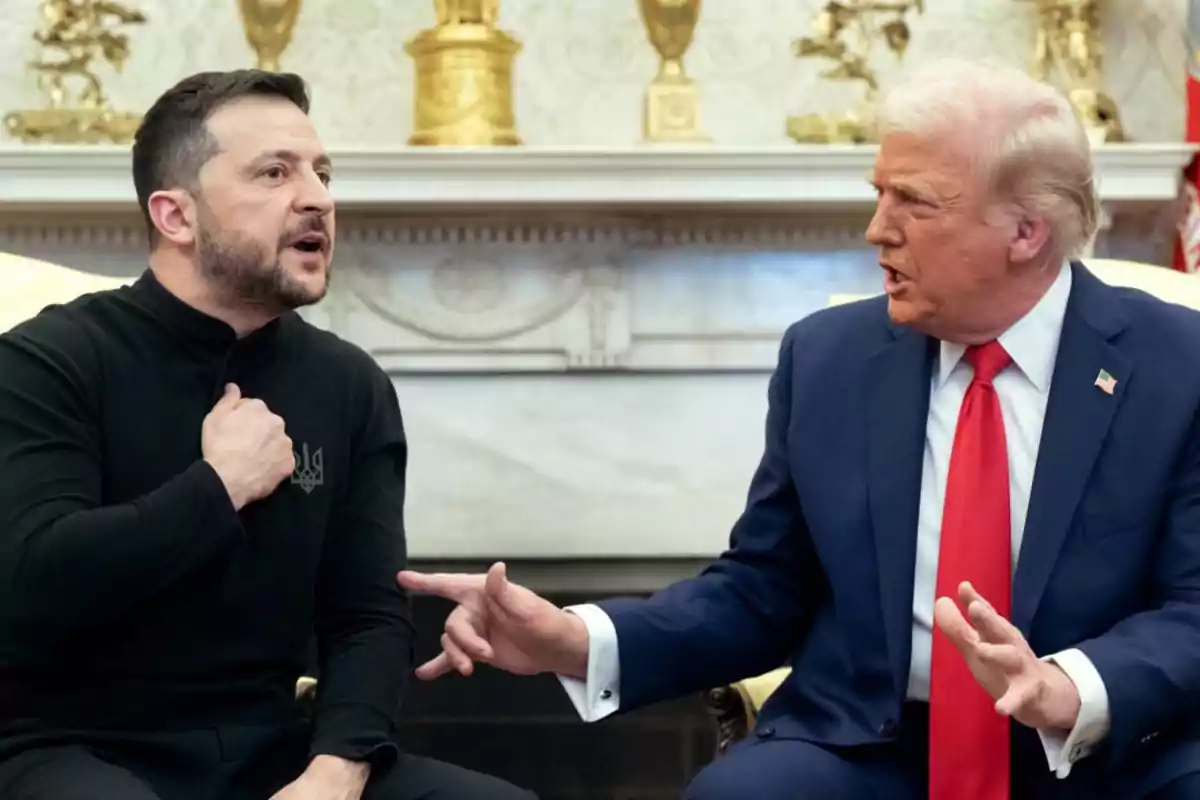 Two men sitting in a room decorated with golden statues, one of them gesturing with his hand while the other listens alertly.