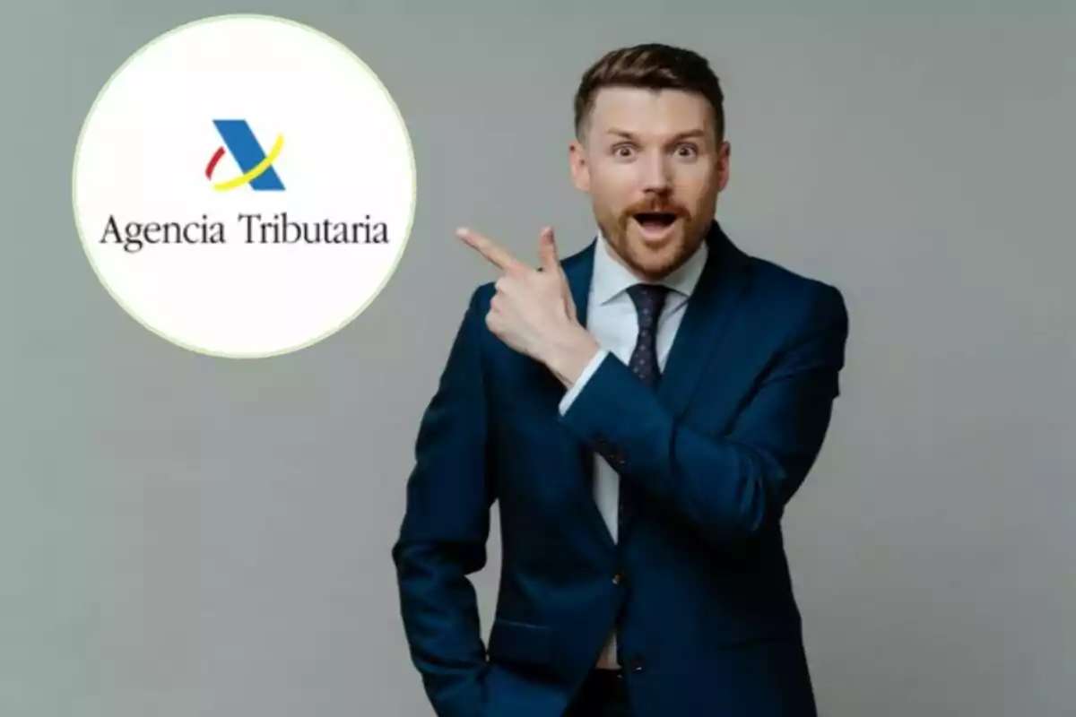 A man in a blue suit and tie points in surprise at a Tax Agency logo on a grey background.