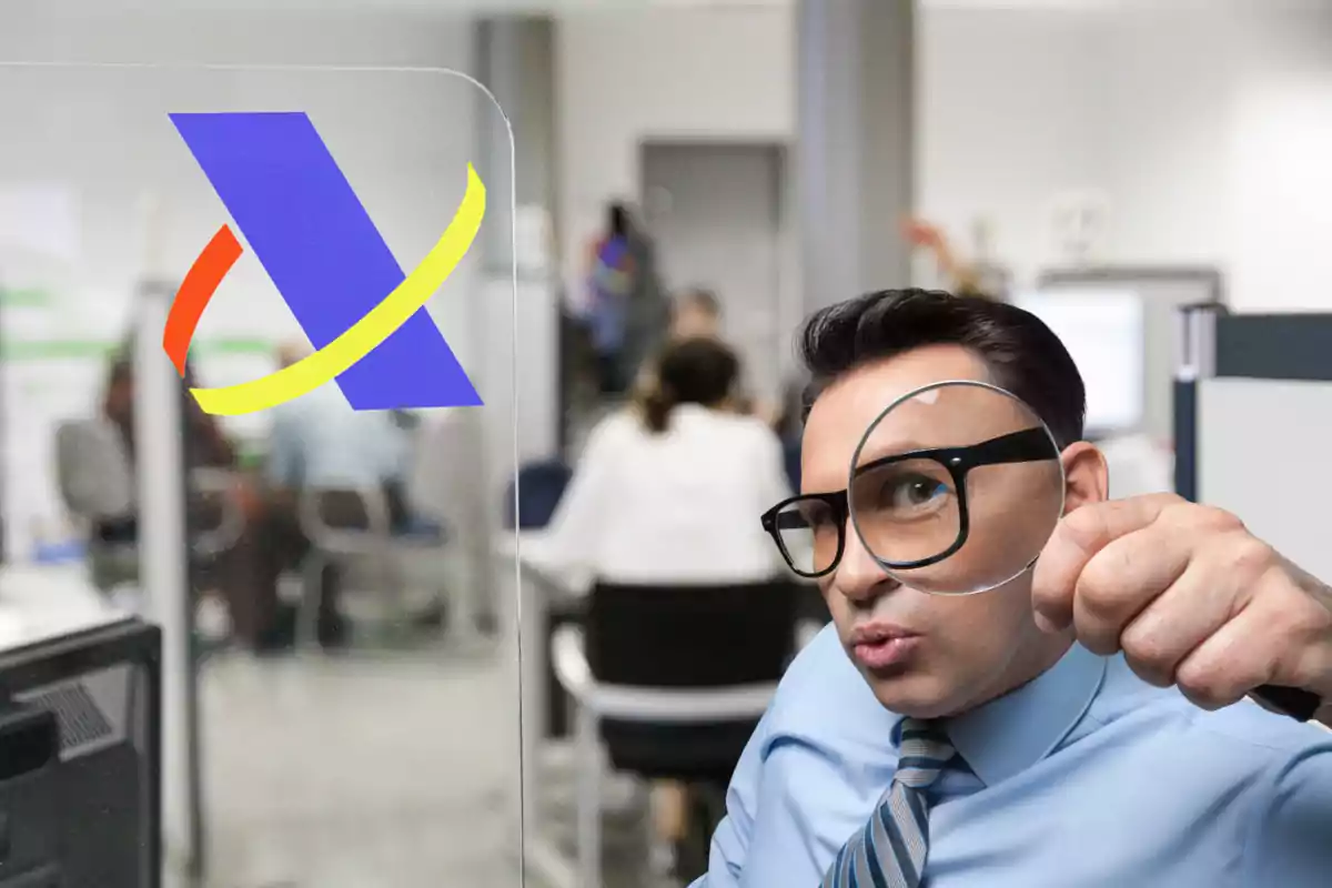 Man with glasses holding a magnifying glass in an office with the Tax Agency logo on a glass.