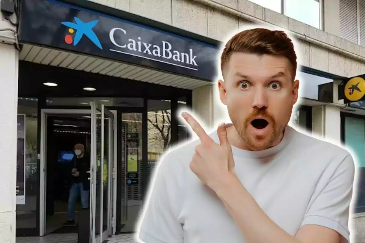 Surprised man pointing at the entrance of a CaixaBank branch.