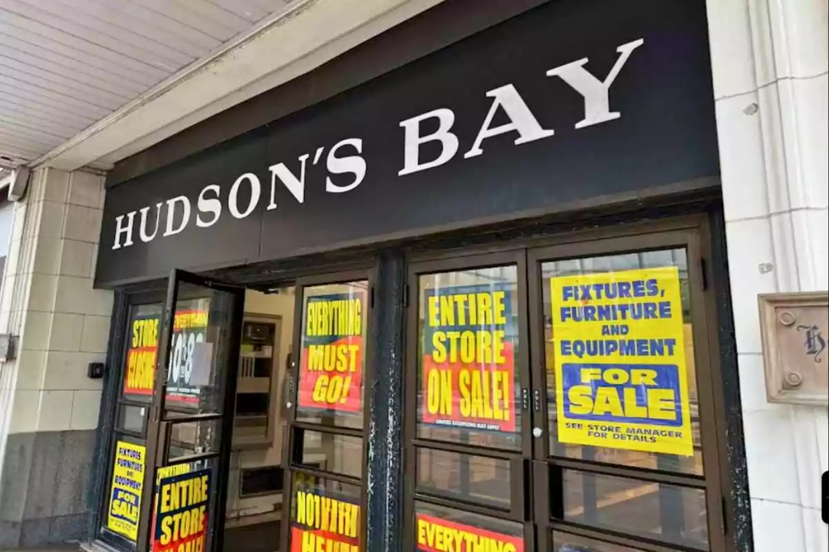 Entrance of a Hudson's Bay store with clearance signs announcing closure and sale of all inventory and fixtures Entrance of a Hudson's Bay store with clearance signs announcing closure and sale of all inventory and fixtures
