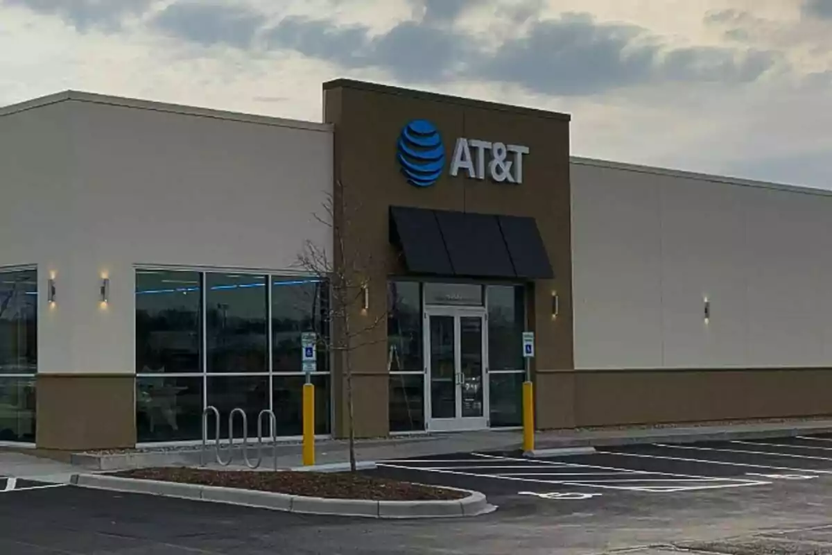 AT&T store facade with an empty parking lot in front. AT&T store facade with an empty parking lot in front.