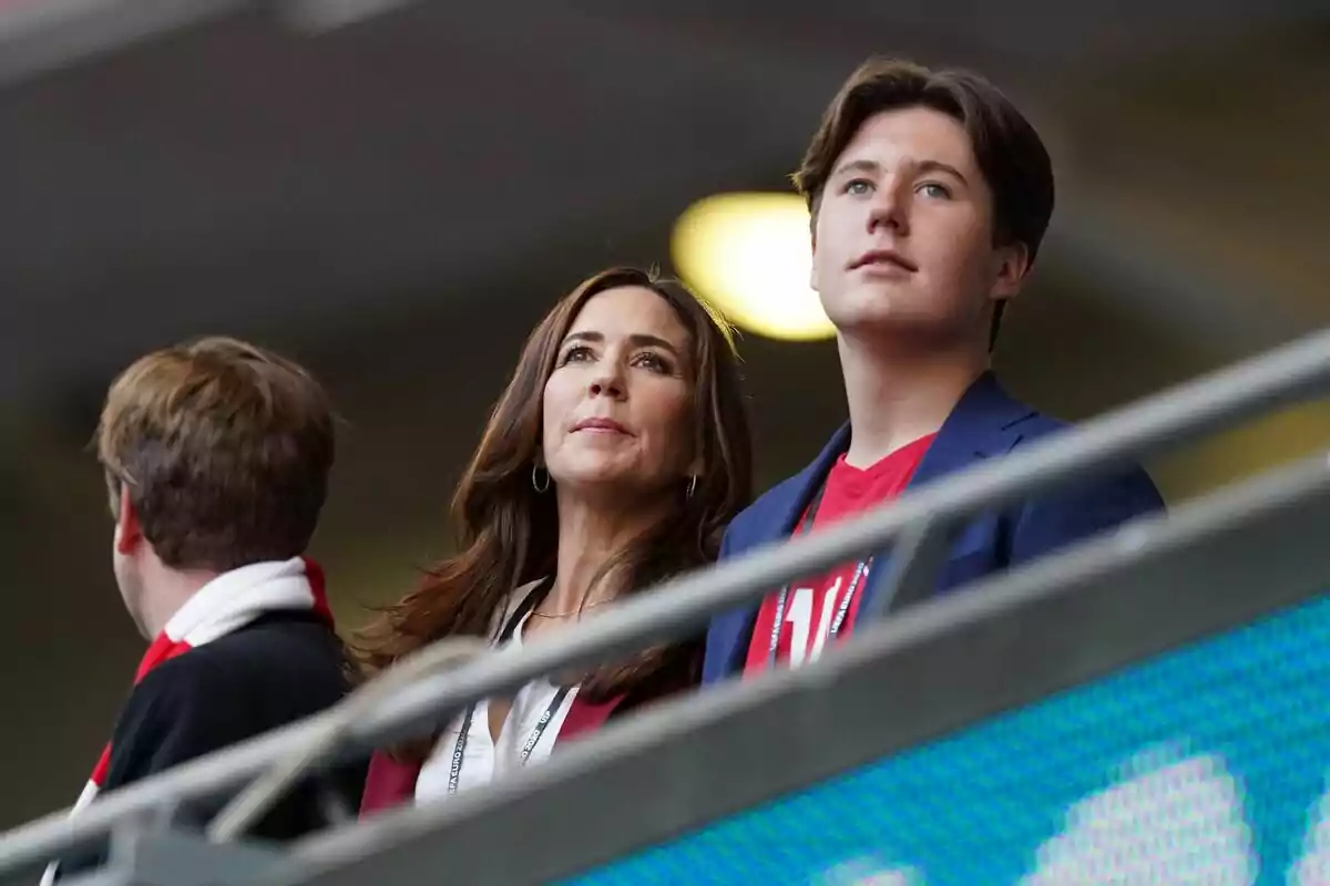 People watching a sporting event from the stands. People watching a sporting event from the stands.