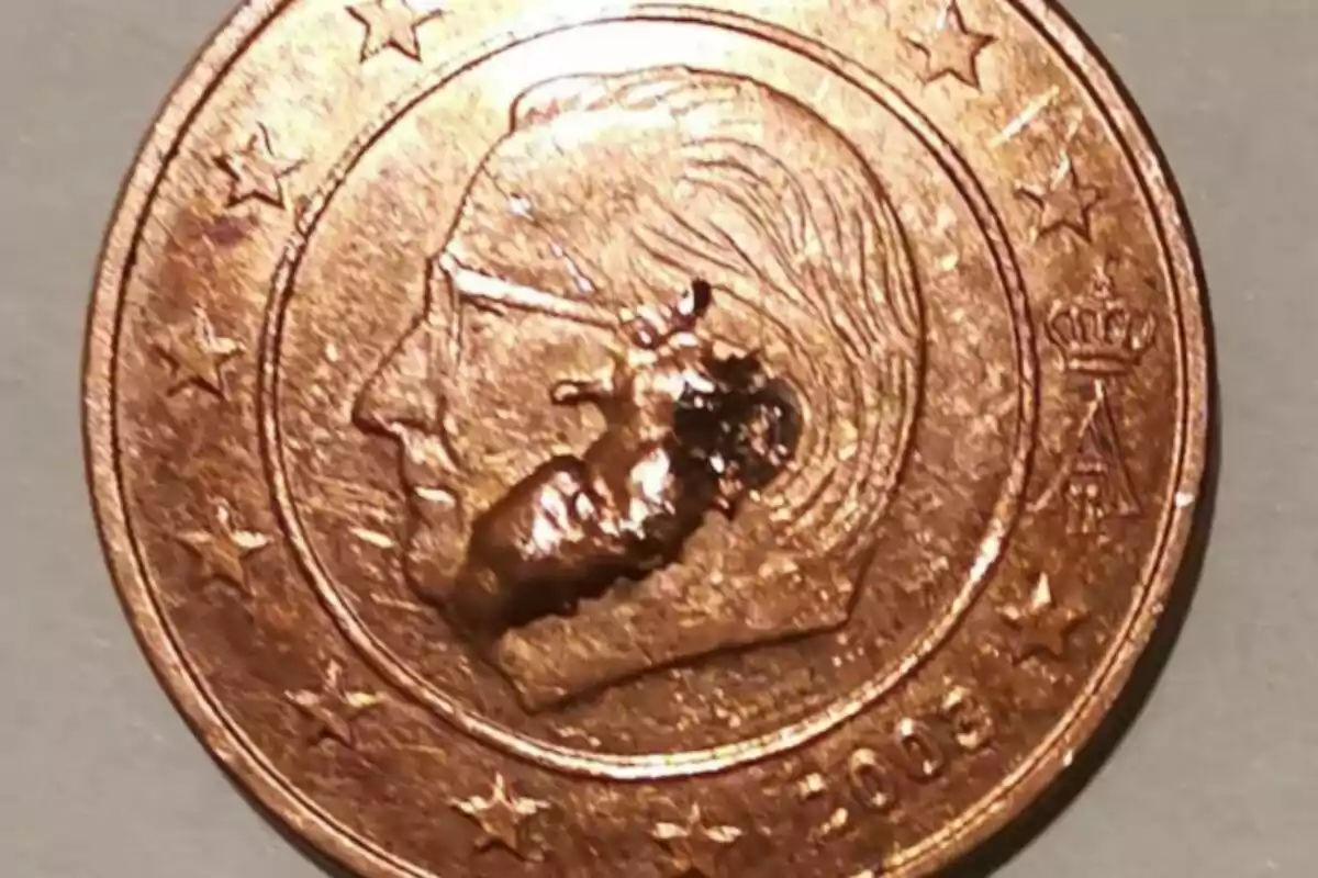 One-cent euro coin with a manufacturing defect that appears to have an additional raised figure on the face.