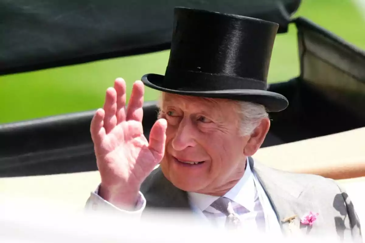 Older man with a top hat greeting and smiling during an outdoor event Older man with a top hat greeting and smiling during an outdoor event