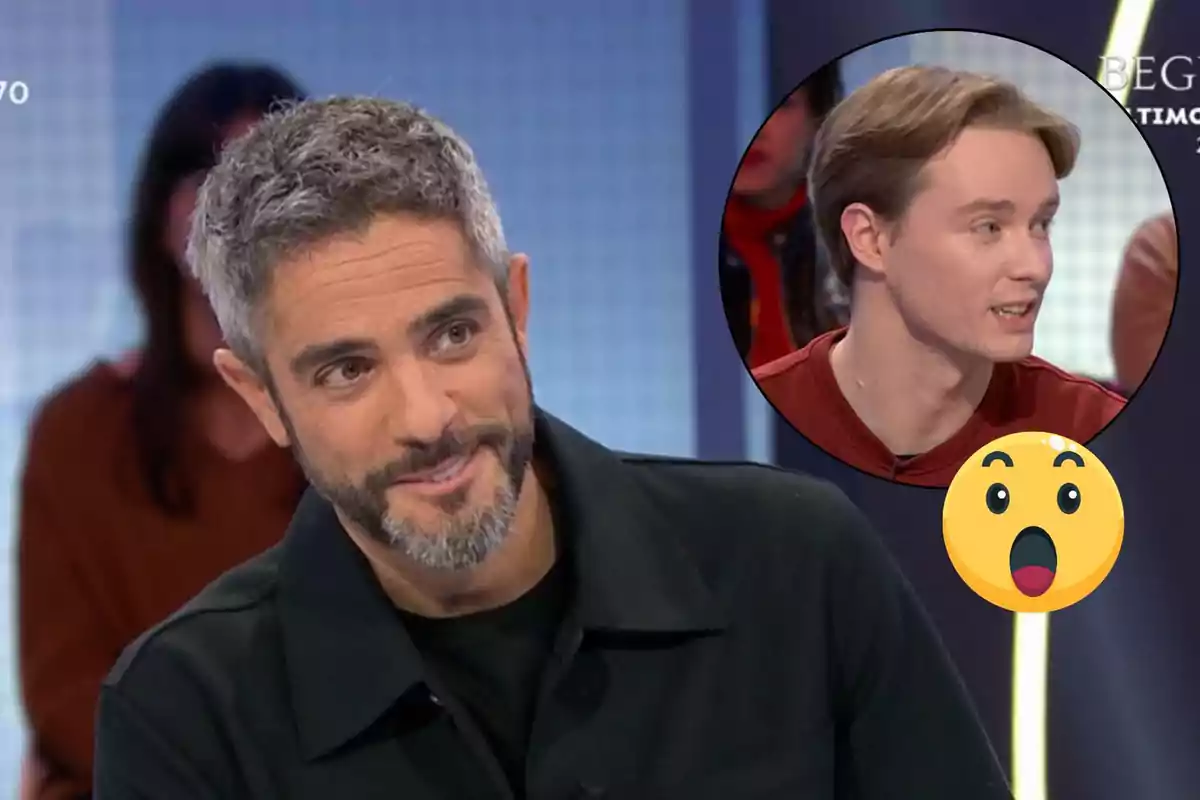 Roberto Leal con barba gris sonríe mientras está en un programa de televisión con un recuadro que muestra a Manu hablando y un emoji sorprendido.