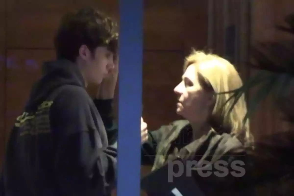 Infanta Cristina touching Pablo Urdangarin's forehead inside a building Infanta Cristina touching Pablo Urdangarin's forehead inside a building