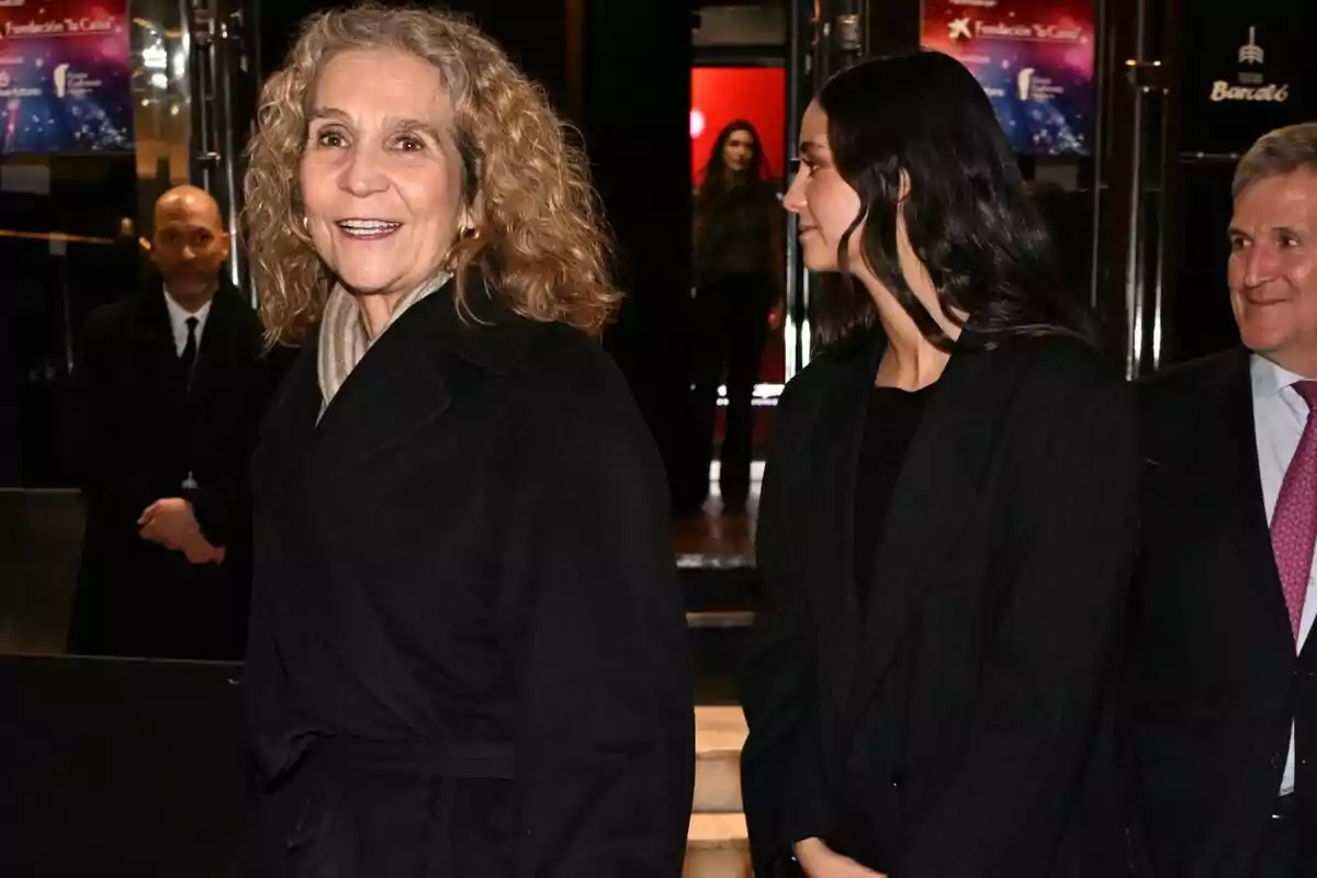 Infanta Elena and Victoria Federica smiling and chatting at a formal event. Infanta Elena and Victoria Federica smiling and chatting at a formal event.