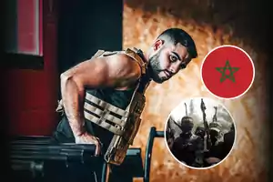 A man in a tactical vest exercising in a gym, with a wooden background and two overlapping circles showing the Moroccan flag and people with weapons.