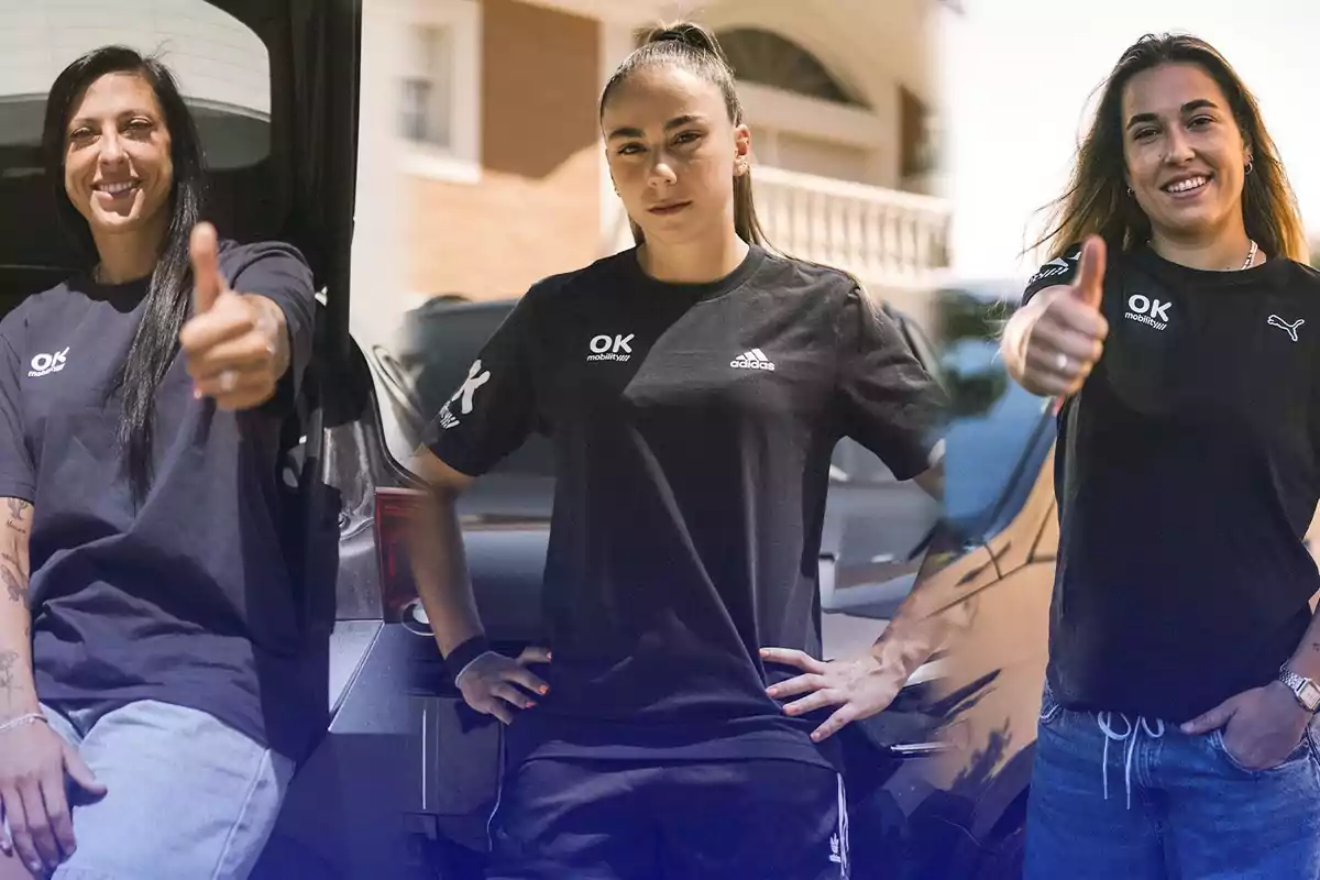 Tres mujeres posando con camisetas negras y mostrando el pulgar hacia arriba.