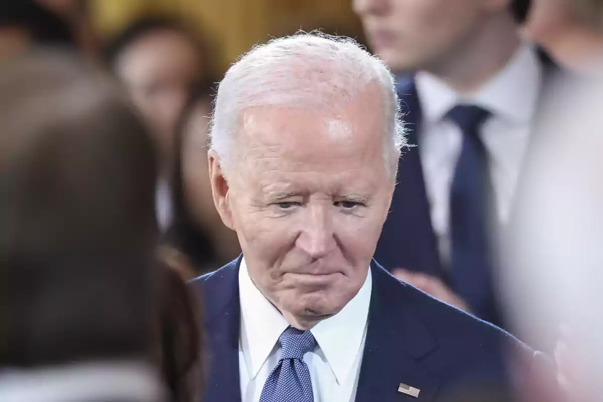 Joe Biden in a blue suit at a formal event. Joe Biden in a blue suit at a formal event.