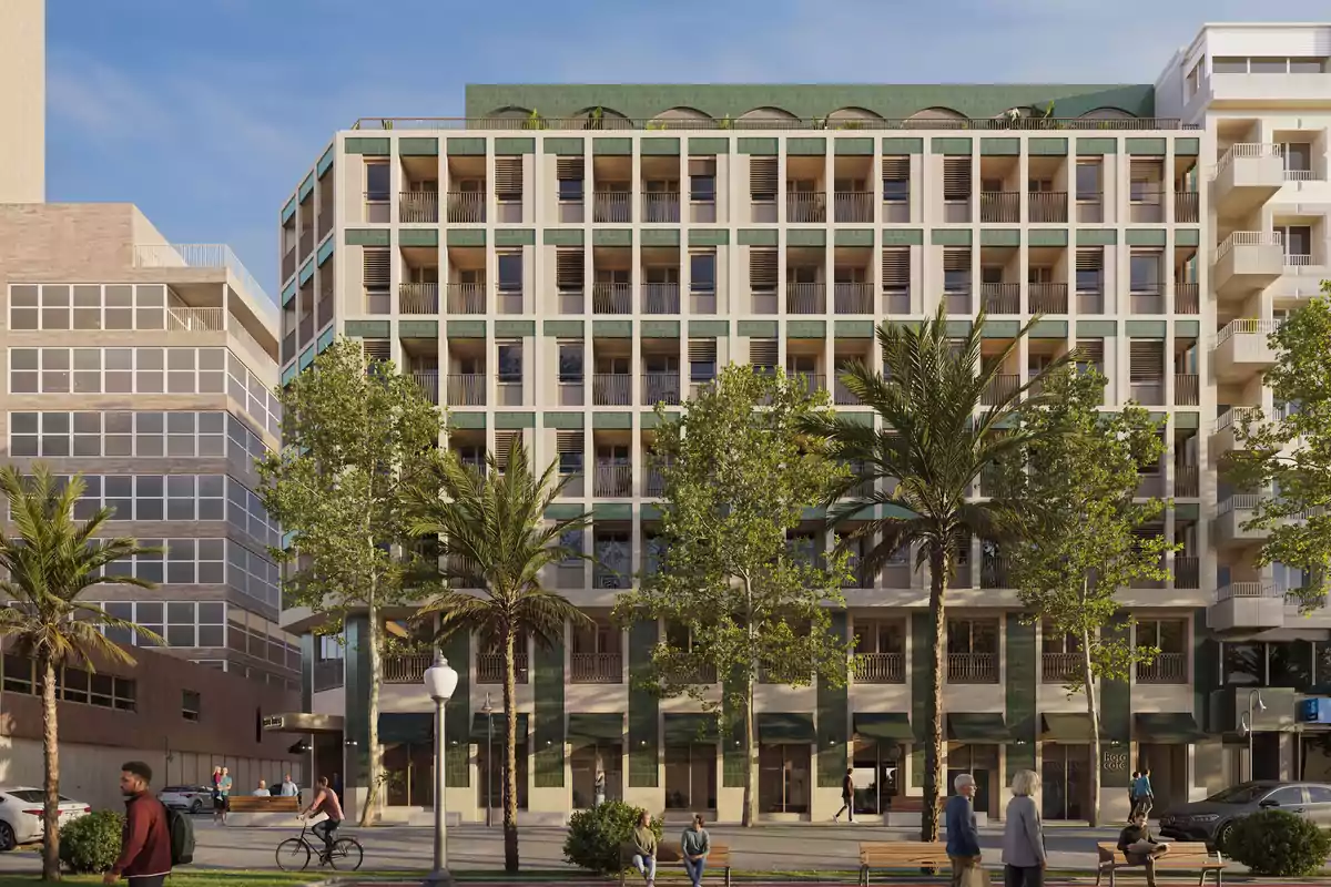 Modern multi-story building with balconies and large windows surrounded by palm trees and people walking and biking on the sidewalk.