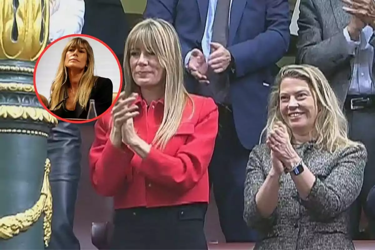 Un grupo de personas aplaude en un evento formal, destacando una mujer de cabello rubio con chaqueta roja en el centro de la imagen.