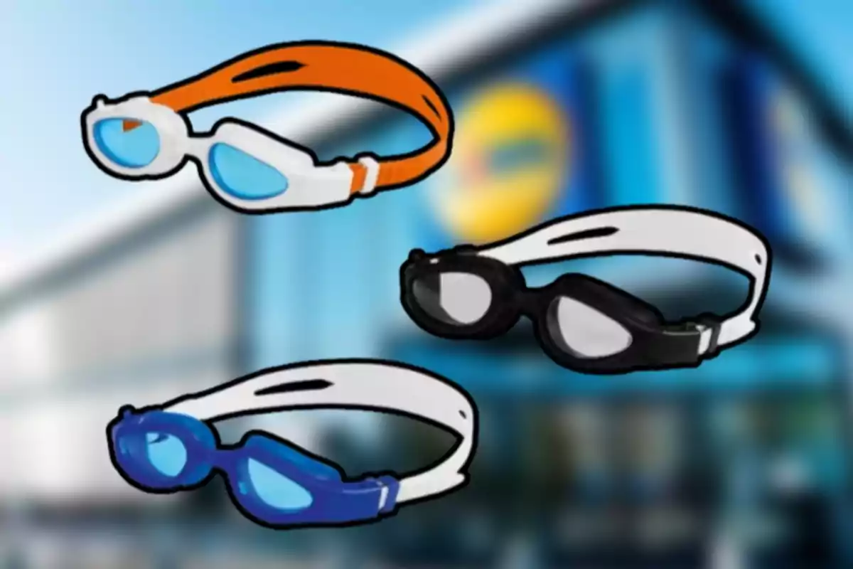 Tres pares de gafas de natación de diferentes colores sobre un fondo borroso de una tienda Tres pares de gafas de natación de diferentes colores sobre un fondo borroso de una tienda