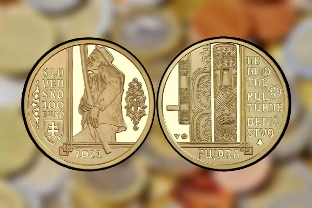 Moneda dorada de 100 euros de Eslovaquia del año 2021 con un hombre tocando una fujara en una cara y detalles decorativos junto a la palabra fujara y un texto en eslovaco en la otra cara Moneda dorada de 100 euros de Eslovaquia del año 2021 con un hombre tocando una fujara en una cara y detalles decorativos junto a la palabra fujara y un texto en eslovaco en la otra cara