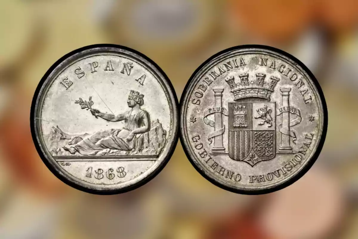 Moneda antigua de España de 1868 con una figura femenina sentada sosteniendo una rama en un lado y un escudo con la inscripción Moneda antigua de España de 1868 con una figura femenina sentada sosteniendo una rama en un lado y un escudo con la inscripción