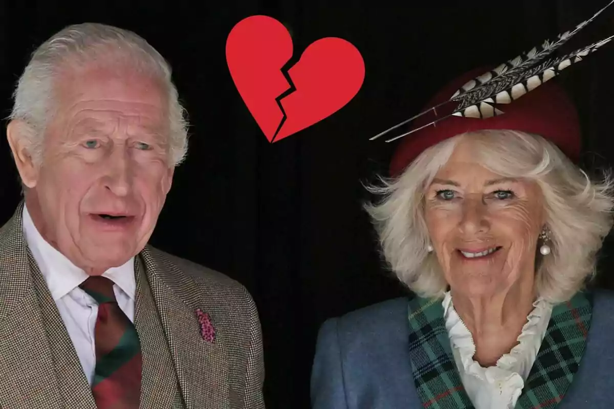 Charles III and Queen Camilla pose together with a red broken heart above them