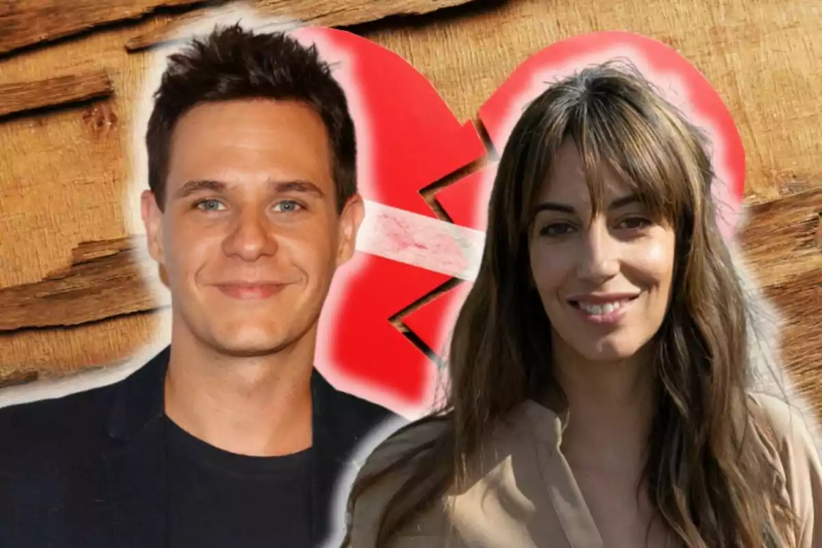 Christian Gálvez and Almudena Cid smiling in front of a wooden background with a broken heart in the center.