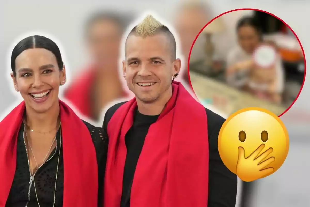 Cristina Pedroche y Dabiz Muñoz sonriente con bufandas rojas y un emoji de sorpresa en la esquina inferior derecha, con un recuadro borroso en el fondo.