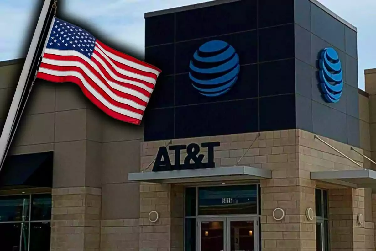 AT&T store facade with a United States flag waving in front. AT&T store facade with a United States flag waving in front.