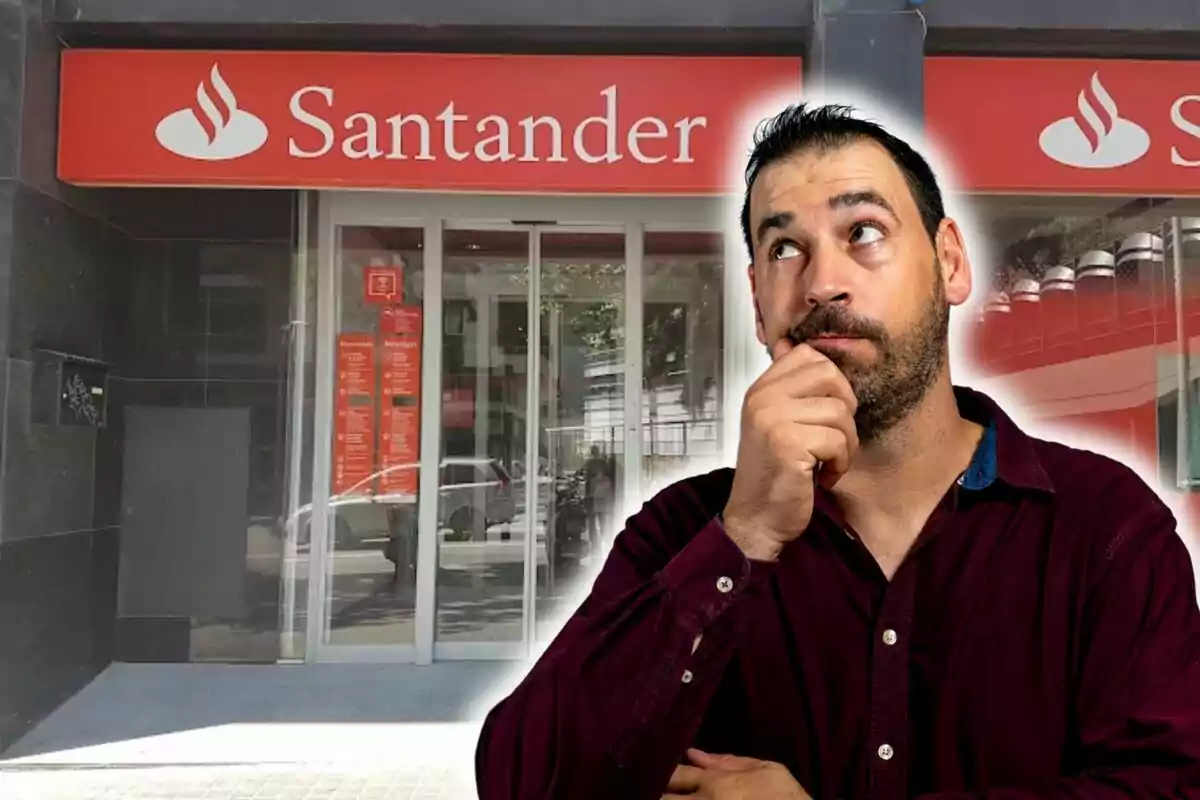 Un hombre pensativo frente a una sucursal del banco Santander.