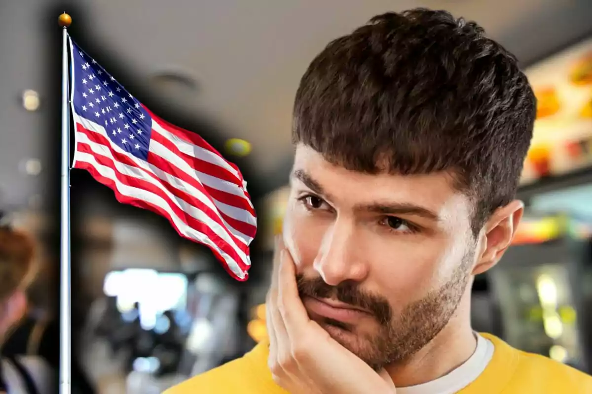 A thoughtful man with a United States flag waving in the background.