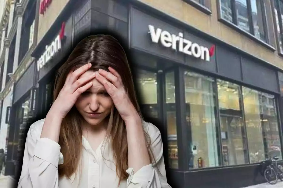 Una mujer con expresión de preocupación se encuentra frente a una tienda de Verizon.