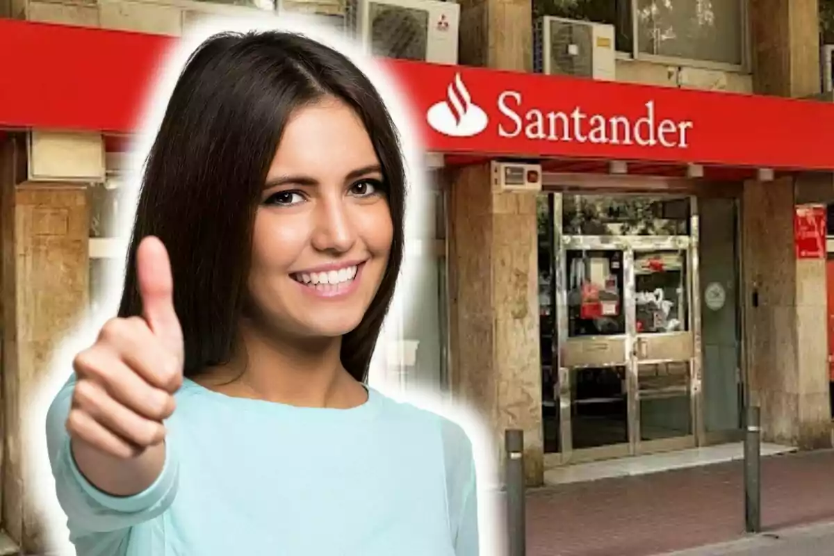 A smiling woman with a thumbs up in front of a Santander bank branch.