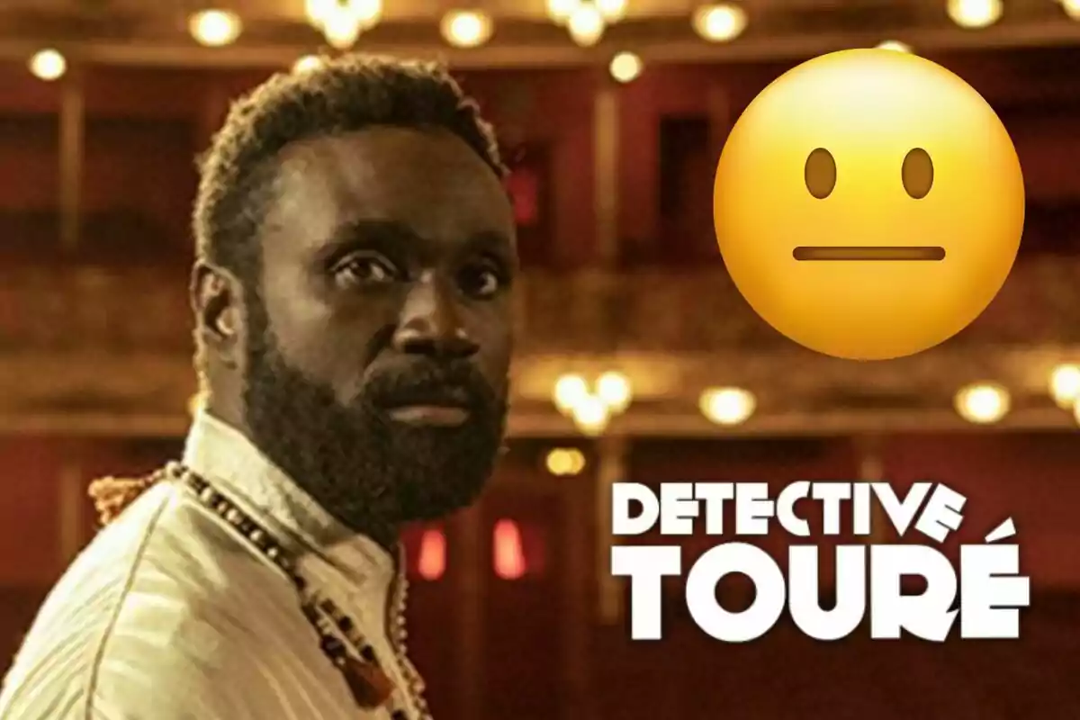 Detective Touré con barba en un teatro con luces brillantes y un emoji neutral al lado del texto "Detective Touré".