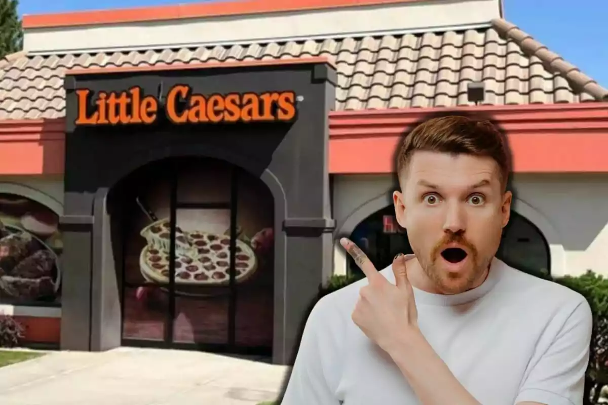 A surprised man points toward a Little Caesars restaurant.