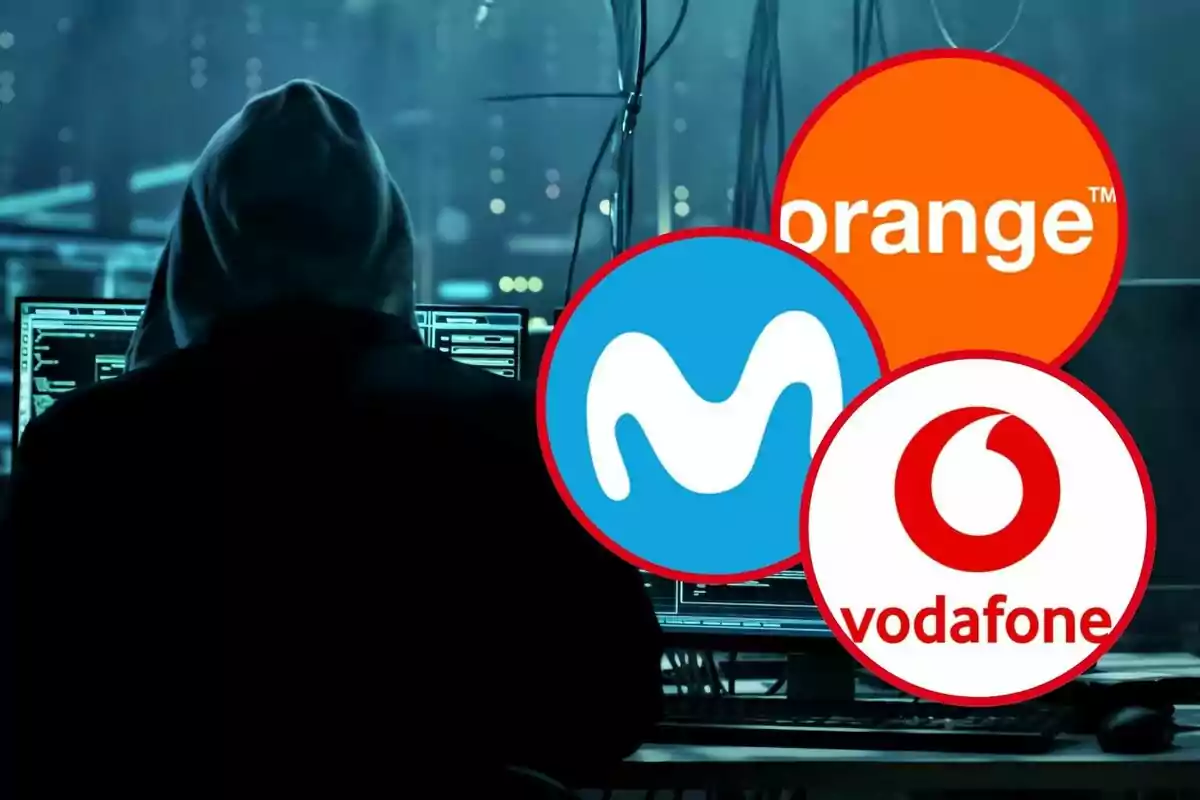 Persona con capucha frente a computadoras con logotipos de Orange, Movistar y Vodafone superpuestos. Persona con capucha frente a computadoras con logotipos de Orange, Movistar y Vodafone superpuestos.