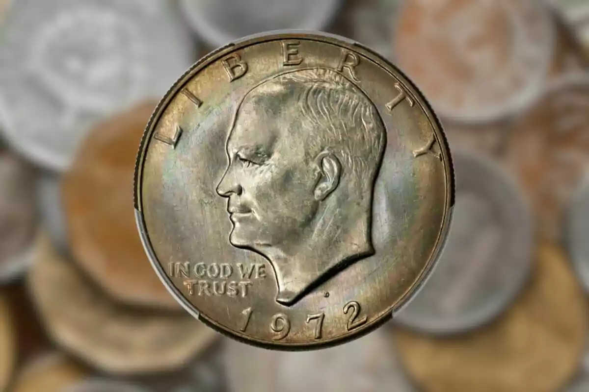 1972 United States one-dollar coin with the profile of a man and the inscription 1972 United States one-dollar coin with the profile of a man and the inscription