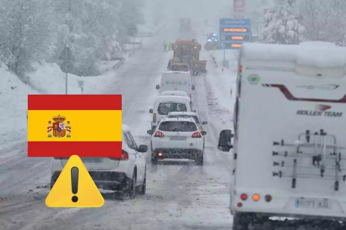 Snowy road in Spain with stopped traffic and vehicles covered in snow.