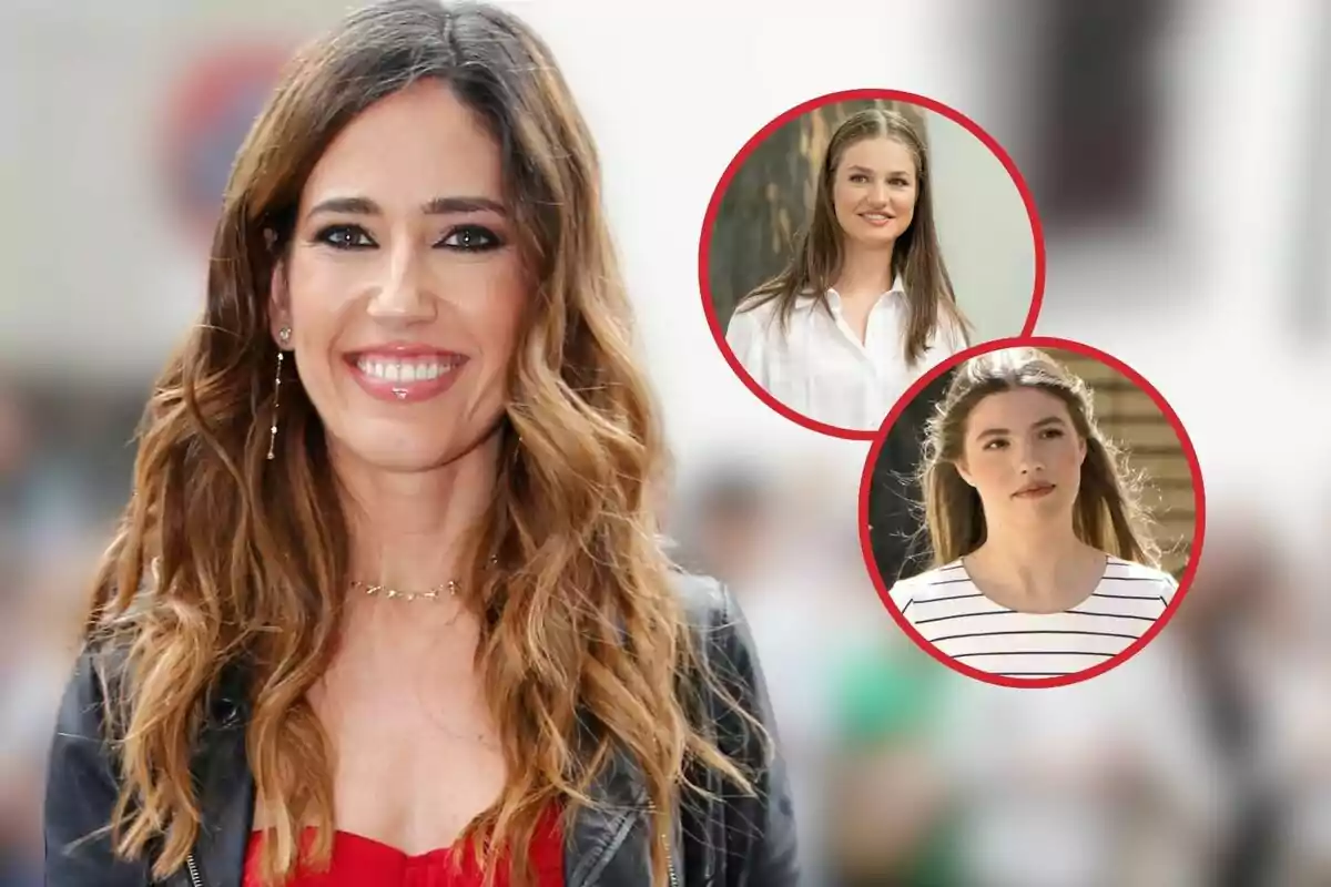 Nuria Marín sonriente con cabello largo y ondulado, vestida con una chaqueta negra y una blusa roja, con dos imágenes circulares de otras de la princesa Leonor y la infanta Sofía en el fondo.