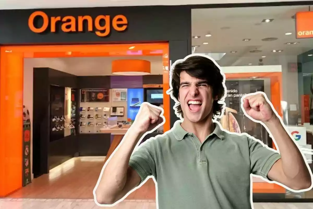 An excited man in front of an Orange store.