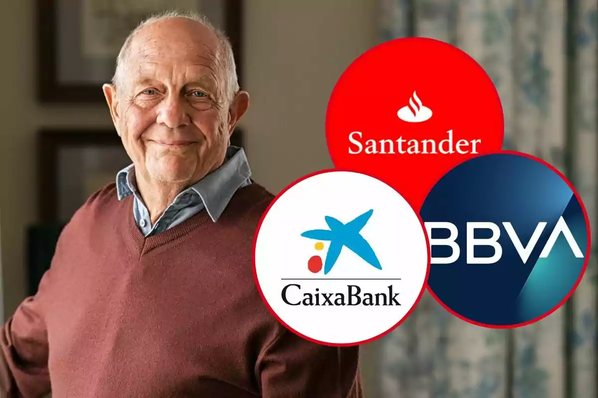 An older man smiles as he stands next to the logos of Santander, CaixaBank and BBVA banks.