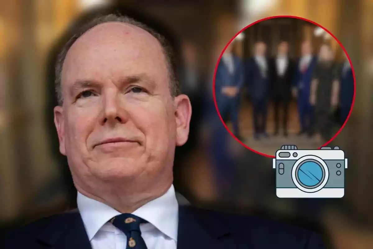 Albert of Monaco in a suit and tie appears in the foreground with a group of blurred people in the background inside a red circle and a camera icon in the corner.