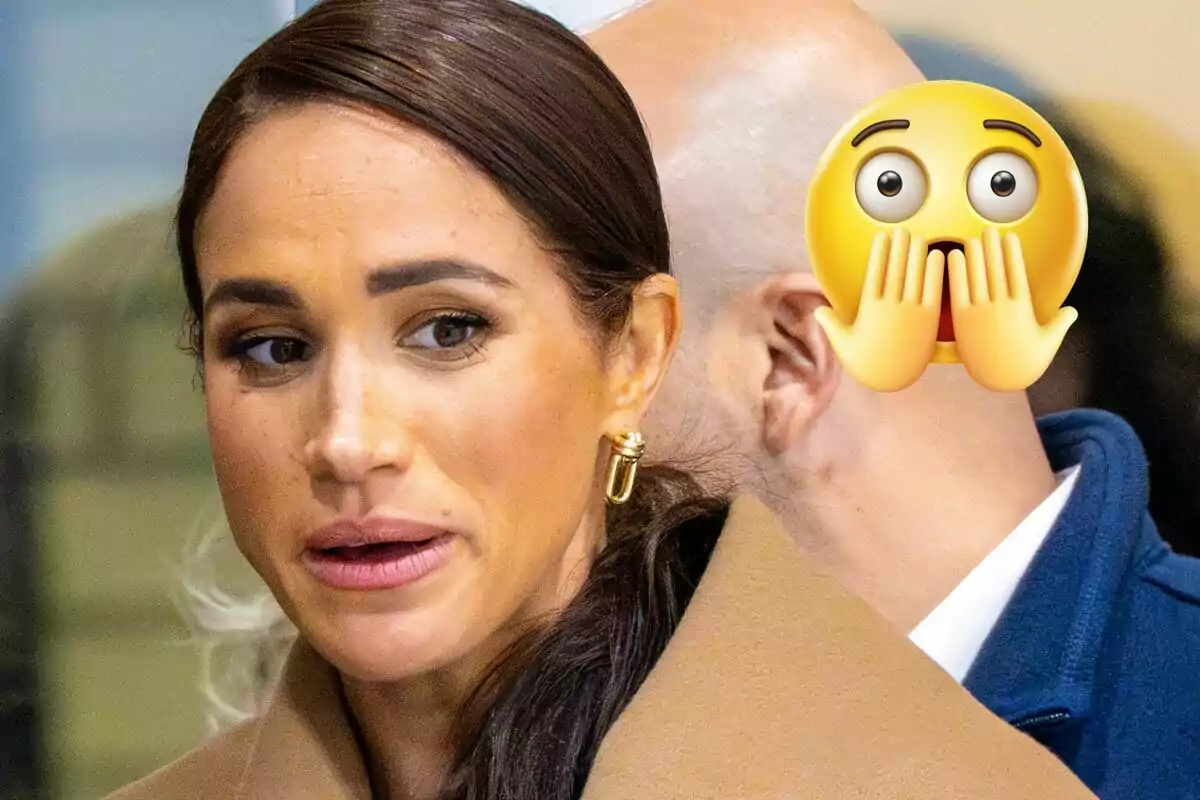 Meghan Markle with a serious expression is in the foreground while a surprised emoji partially covers another person in the background.