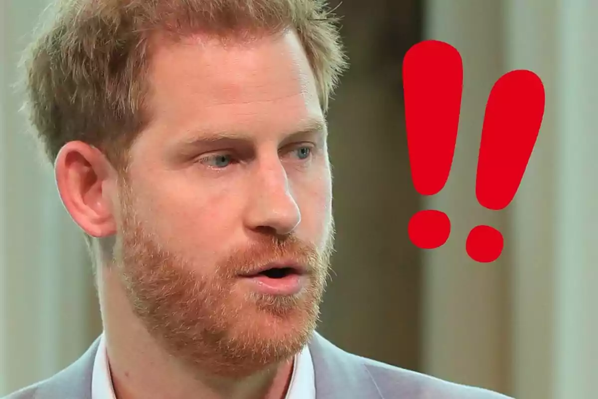 Prince Harry with a serious expression next to two red exclamation marks.