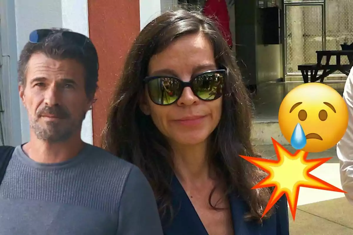 Rodolfo Sancho y Silvia Bronchalo posando al aire libre, con una mujer usando gafas de sol y un hombre con barba, acompañados de emojis de tristeza y explosión.