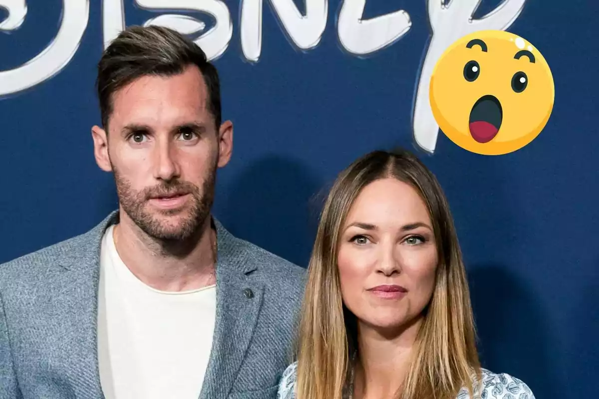 Rudy Fernández y Helen Lindes posando frente a un fondo azul con un logotipo de Disney y un emoji sorprendido.