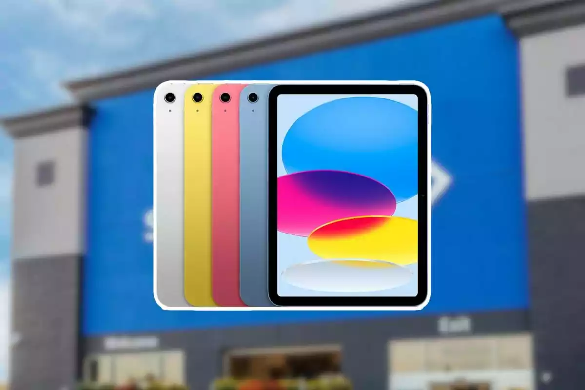 Colorful tablets and a screen with an abstract design in front of a blue building. Colorful tablets and a screen with an abstract design in front of a blue building.