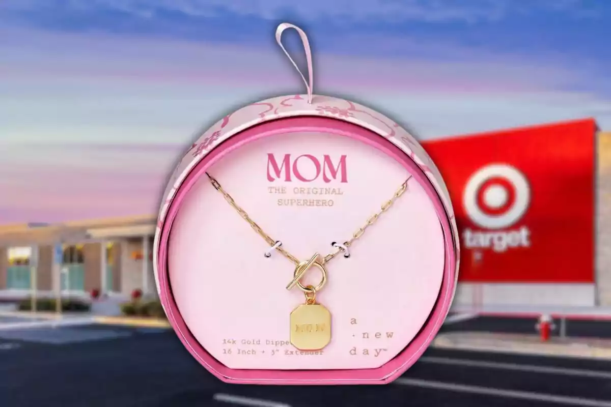 A golden necklace with a pendant that says A golden necklace with a pendant that says