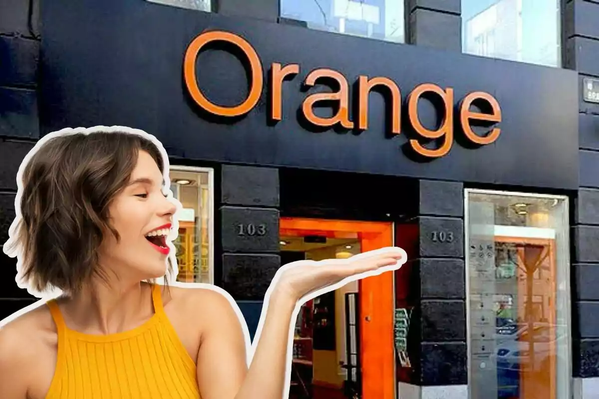 A smiling woman in a yellow dress holds her hand out in front of a store with the sign "Orange".