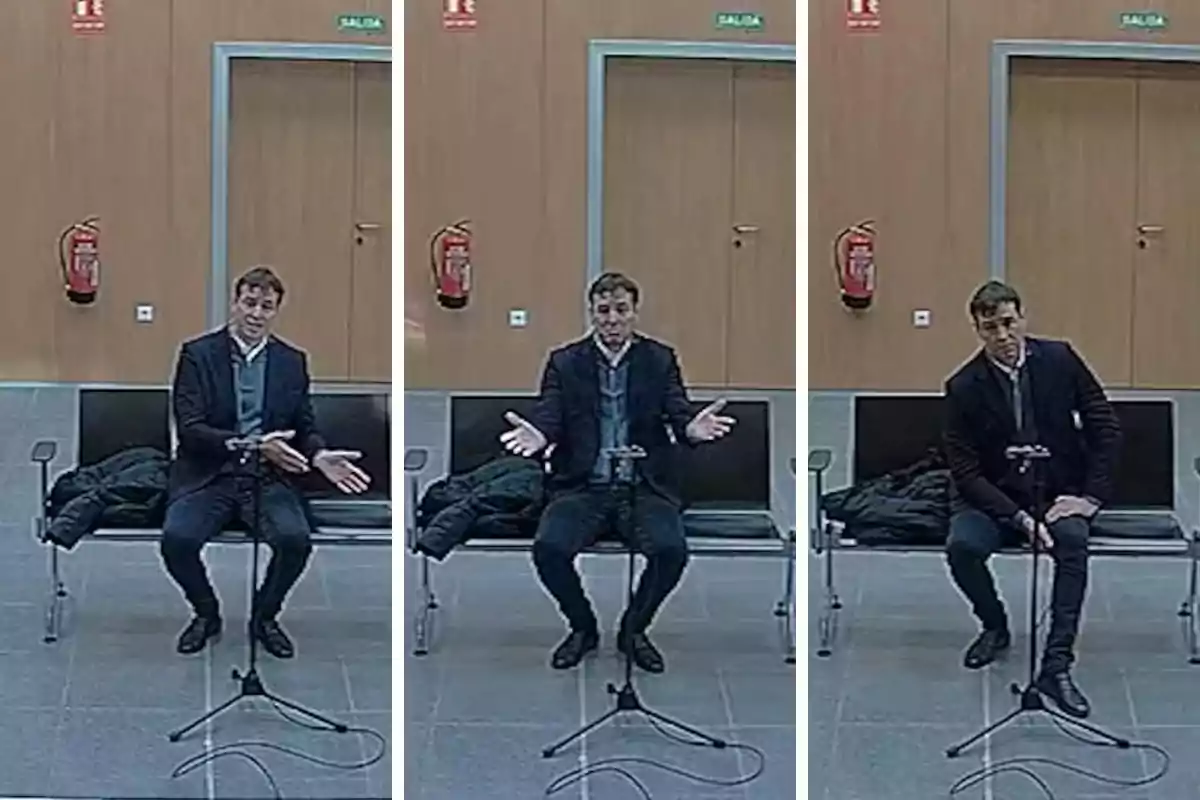 A man sitting in a waiting room with a microphone in front of him, gesturing with his hands in different positions.