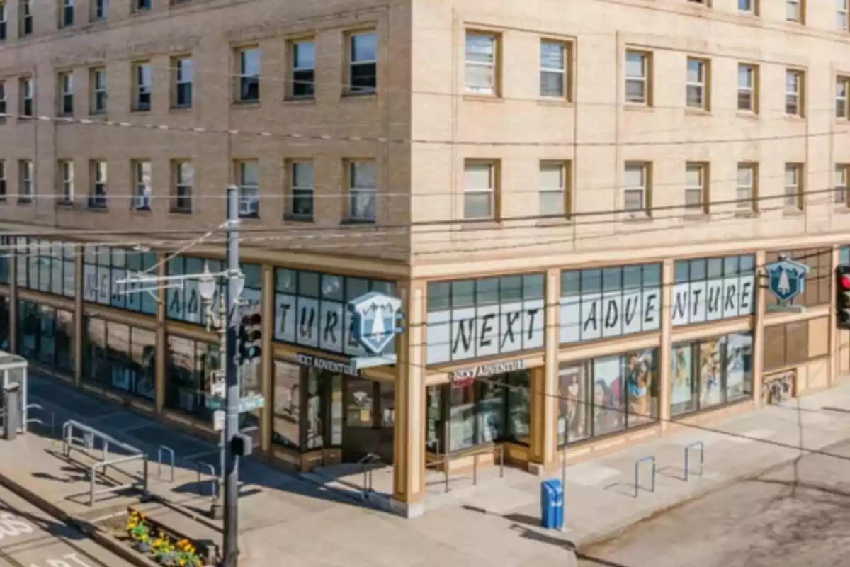 A corner store with large windows and a sign that says A corner store with large windows and a sign that says