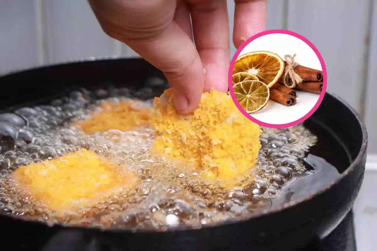 Una mano sumergiendo un alimento empanizado en aceite caliente con un círculo que muestra rodajas de naranja seca y ramas de canela.