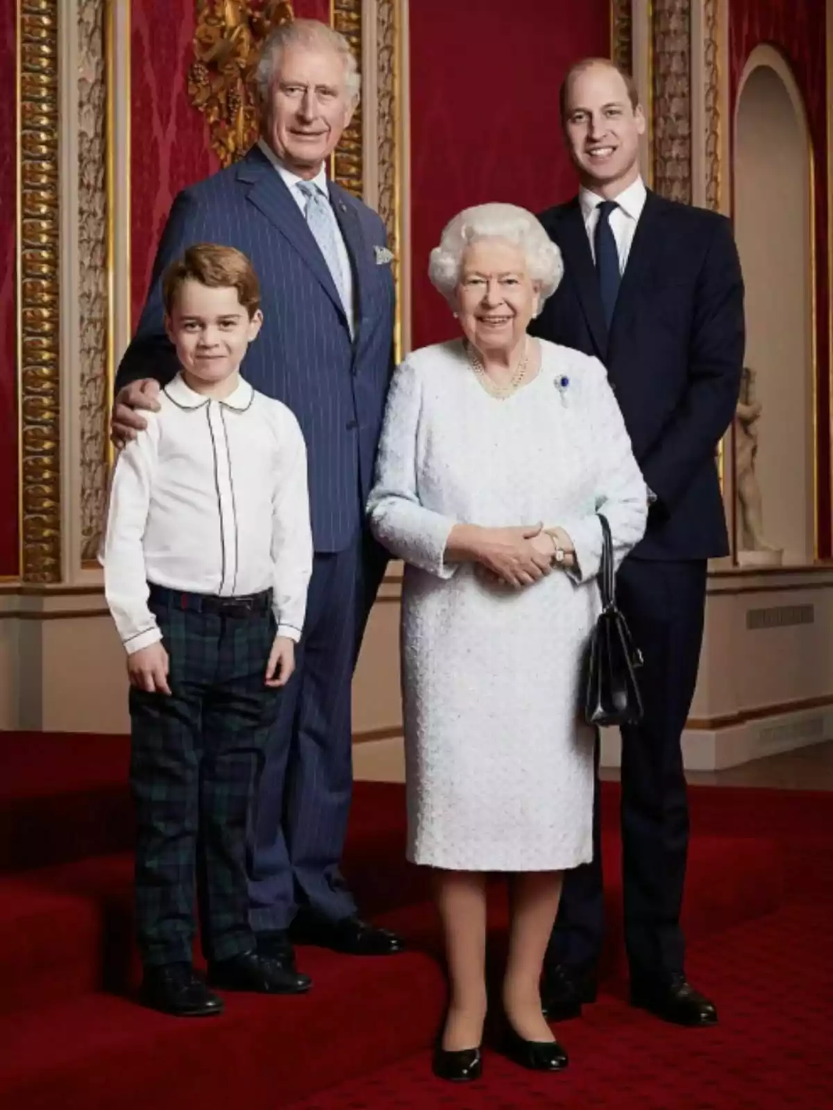 A group of people posing in an elegant setting with a red carpet and decorated walls. A group of people posing in an elegant setting with a red carpet and decorated walls.