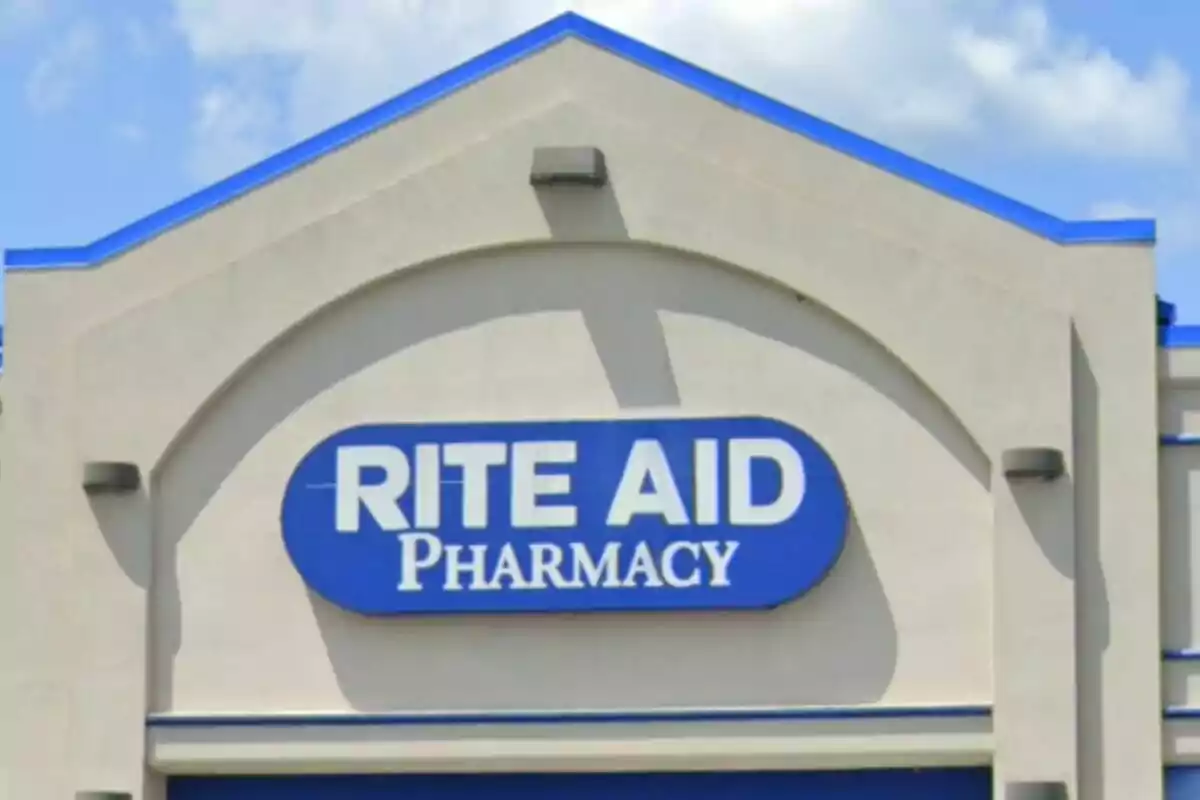 Facade of a pharmacy with a blue sign that says Facade of a pharmacy with a blue sign that says