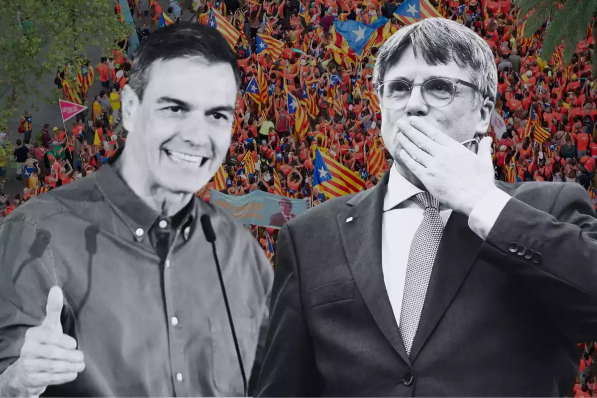 Concentración independentista en Barcelona cara de Pedro Sánchez y Carles Puigdemont